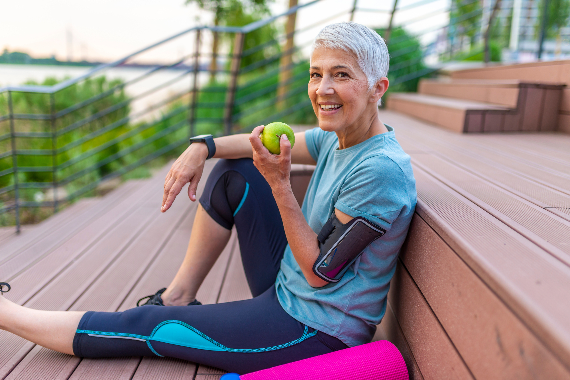 Elder woman eating an apple